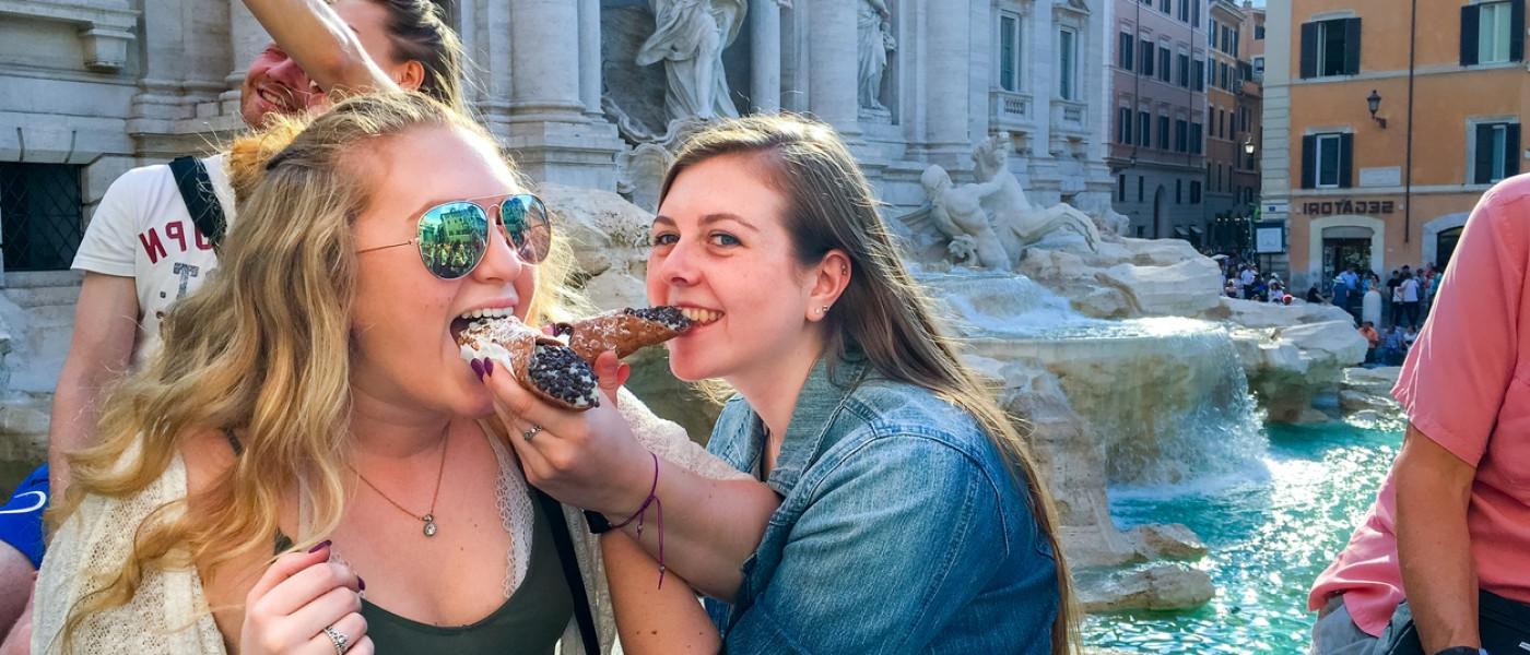 UNE Students eating a cannoli in Italy